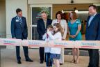 Children cut a ceremonial band-aid at the opening of Nemours Children’s Specialty Care, Pensacola
